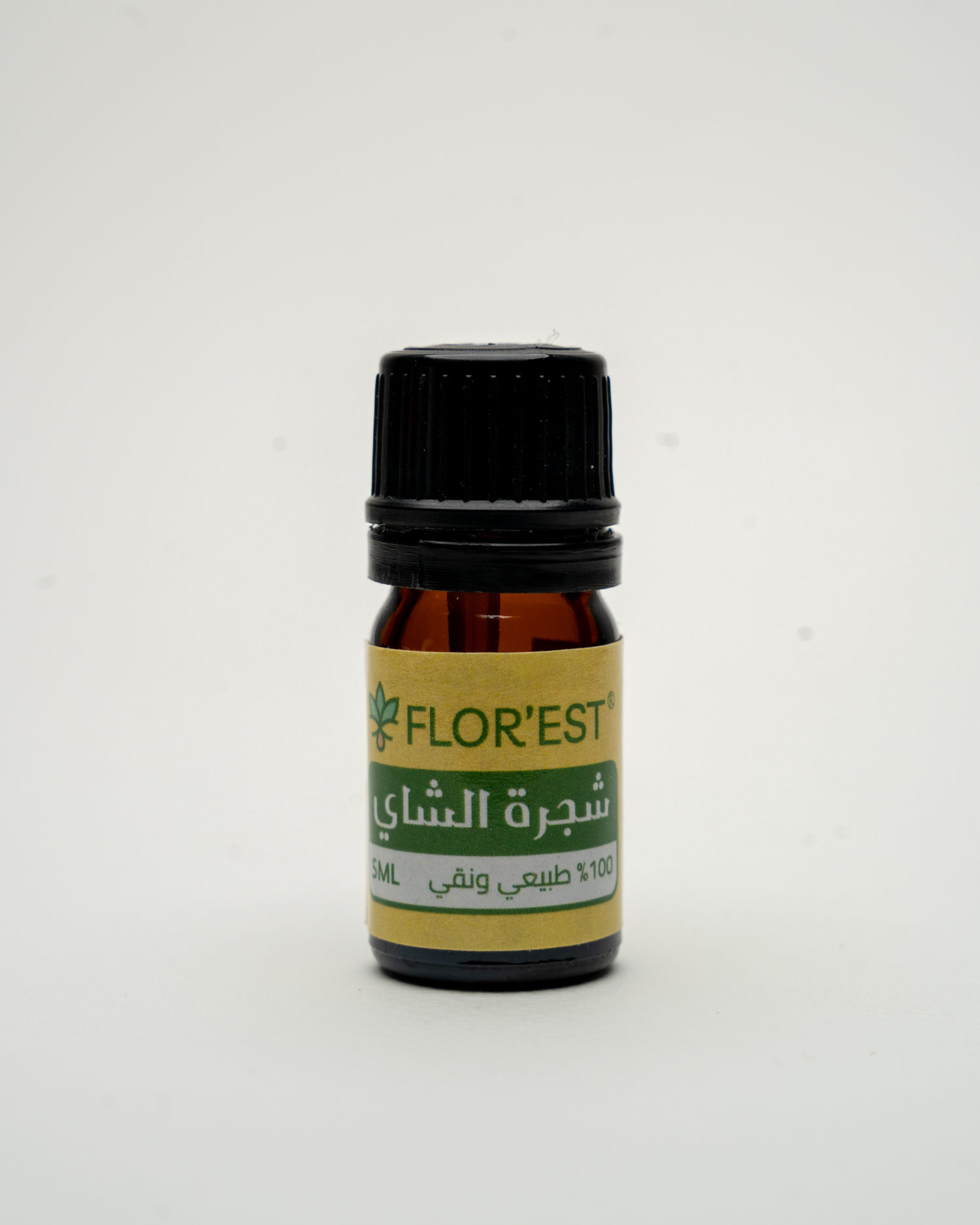 small bottle with yellow packaging of tea tree essential oil